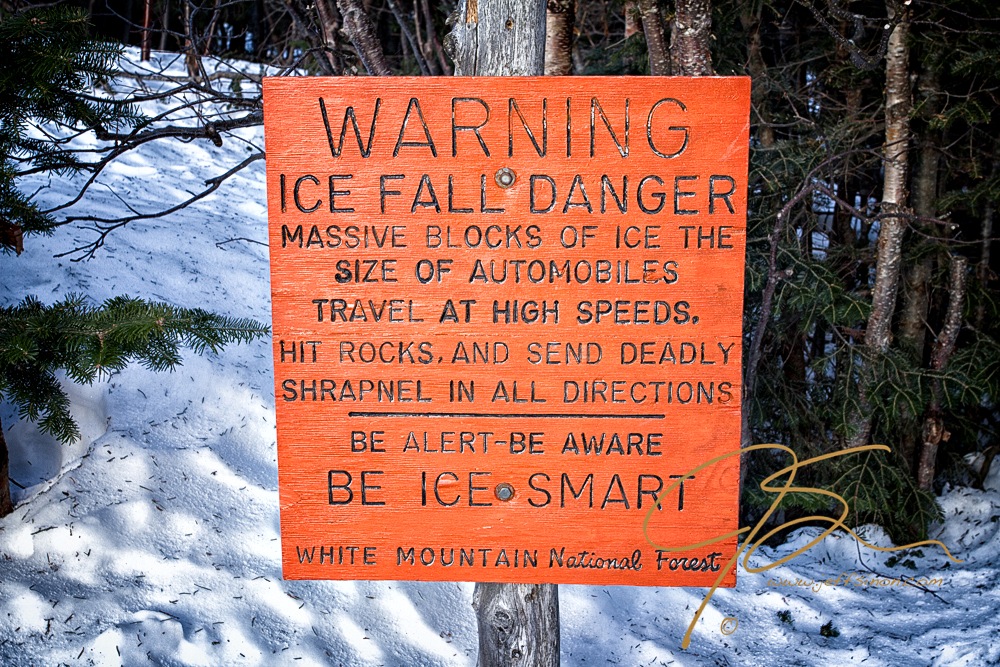 Bright orange ice fall warning sign in Tuckerman Ravine